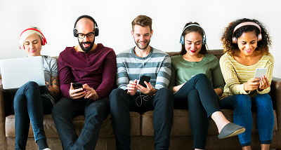 Group of people listening to music on music streaming service on smartphone