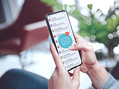 smartphone user scrolling through email app